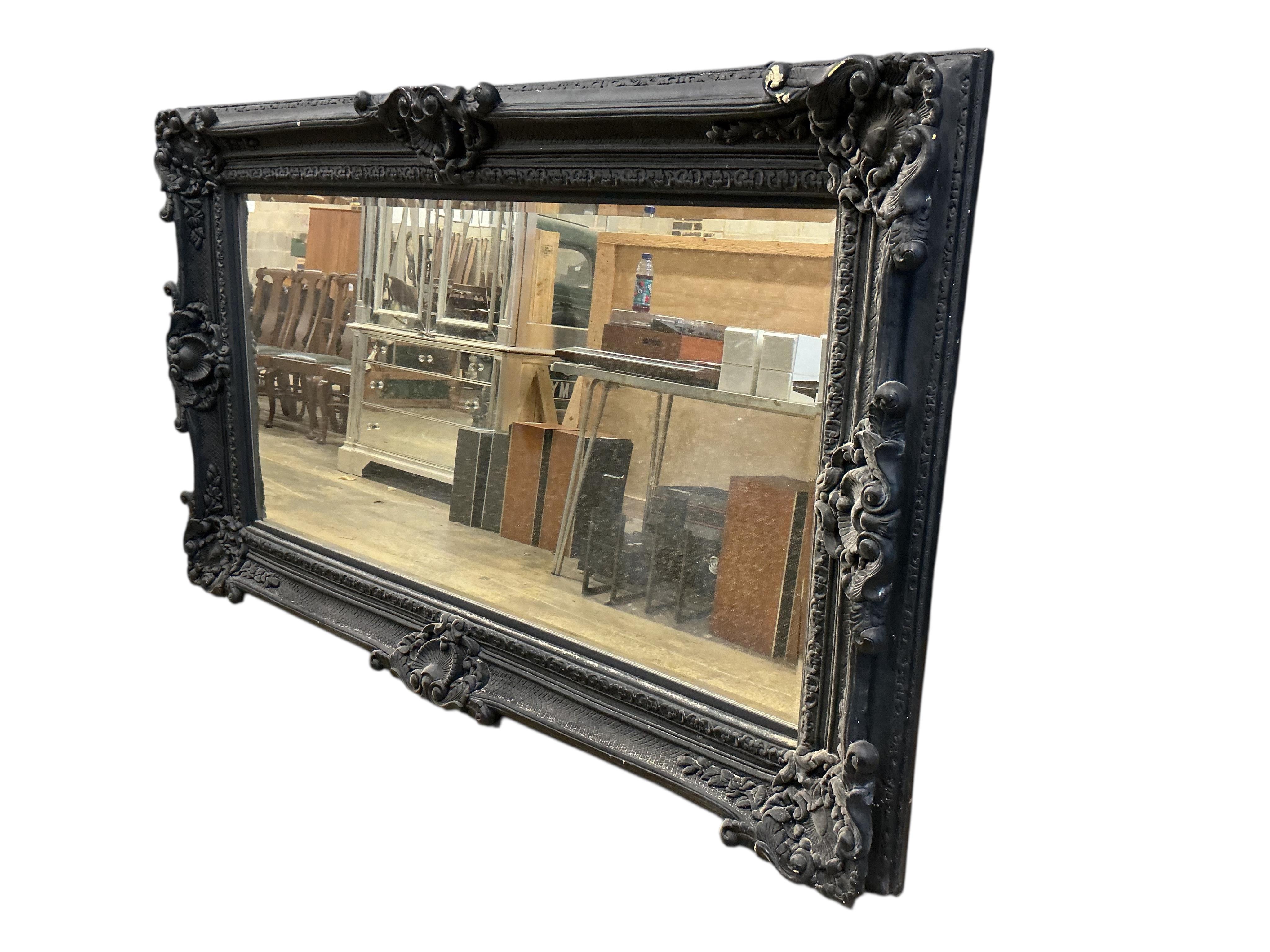 A large Victorian style 'Heritage' rectangular black painted wall mirror, width 226cm, height 136cm